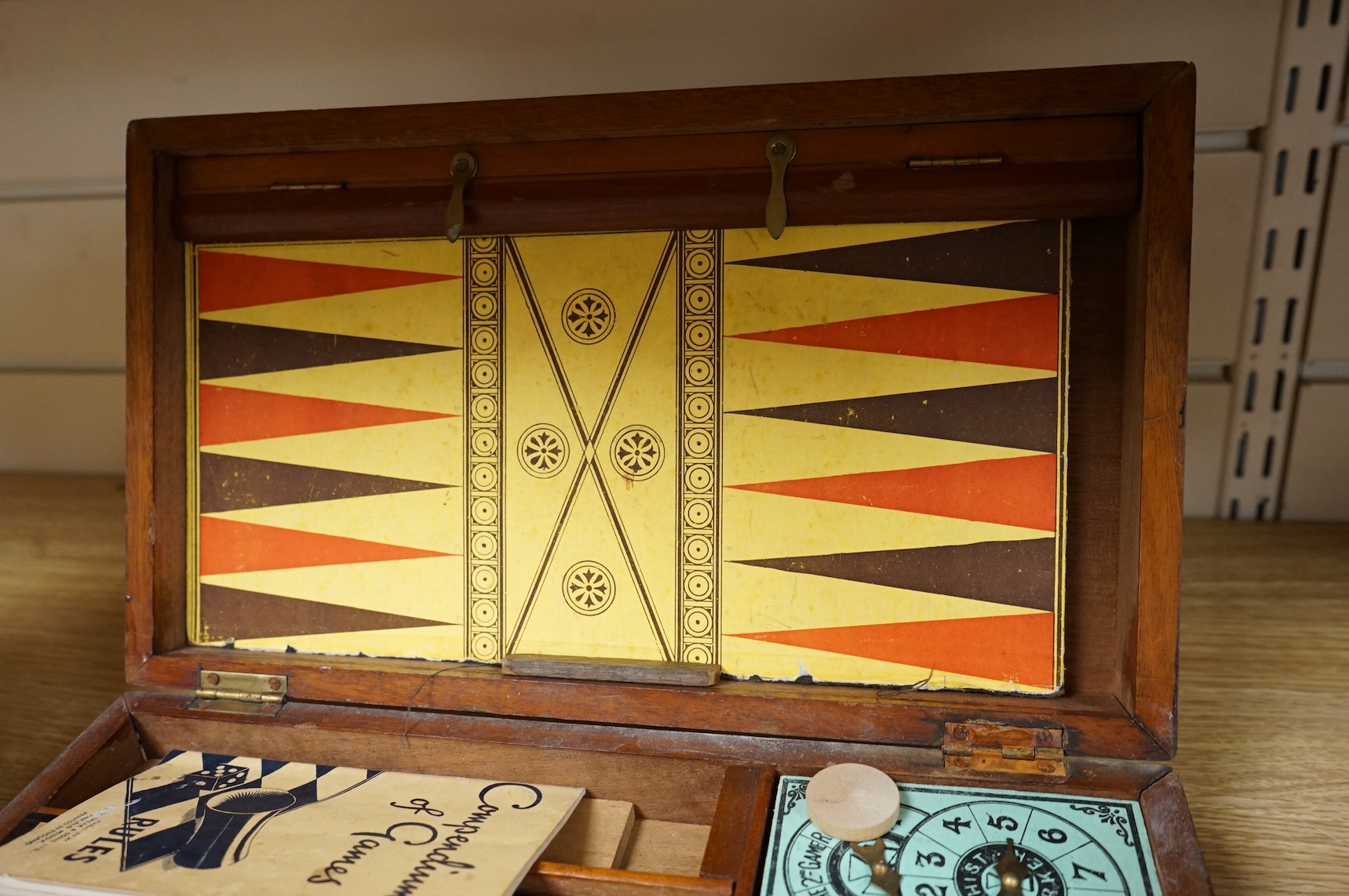 A wooden boxed games compendium, 33cm wide x 19.5cm deep